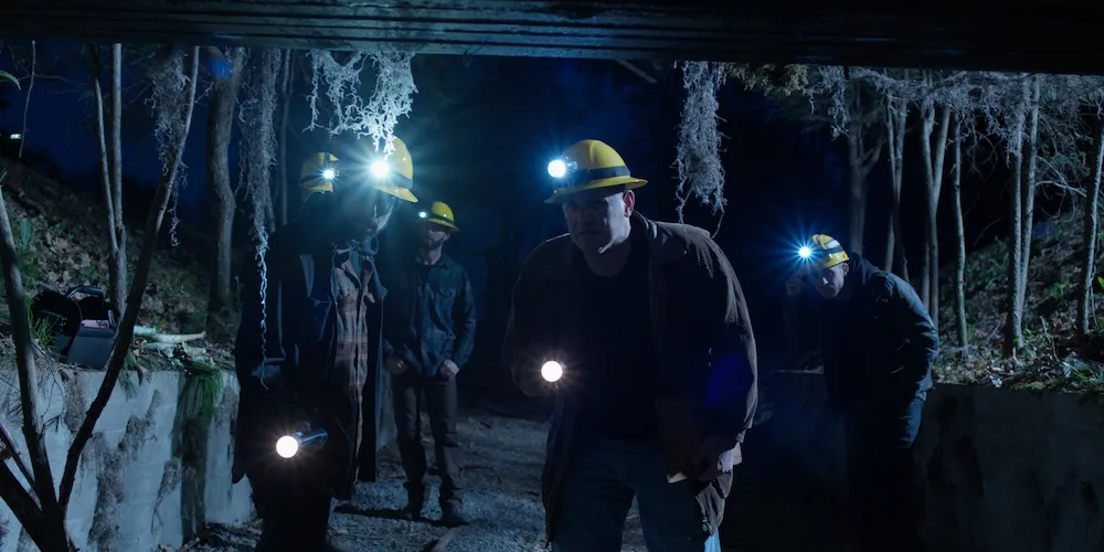 Still from 'Dark Hollow' of miners in a cave.