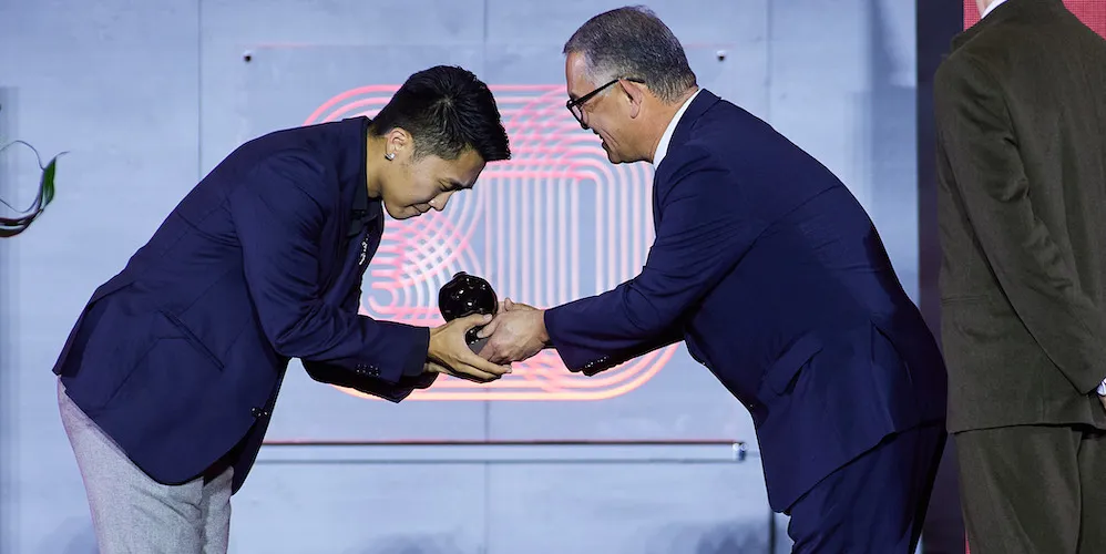 A filmmaker accepts an award
