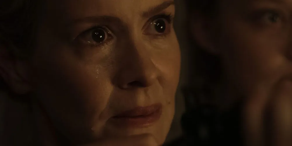 Woman crying in a dark room. 