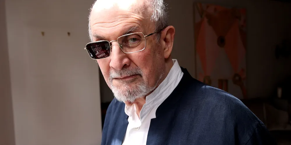 A man with a pair of glasses that has one lens blacked out