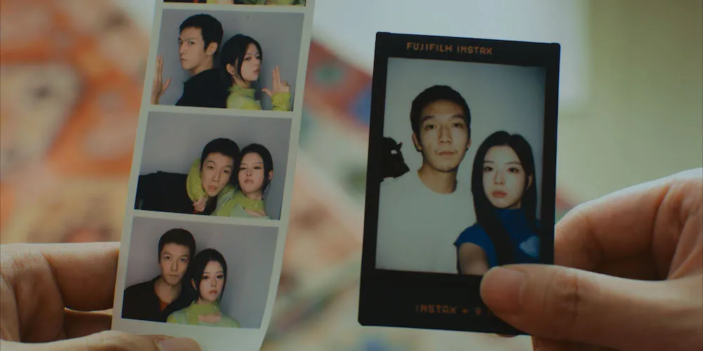 close-up on polaroids featuring a couple