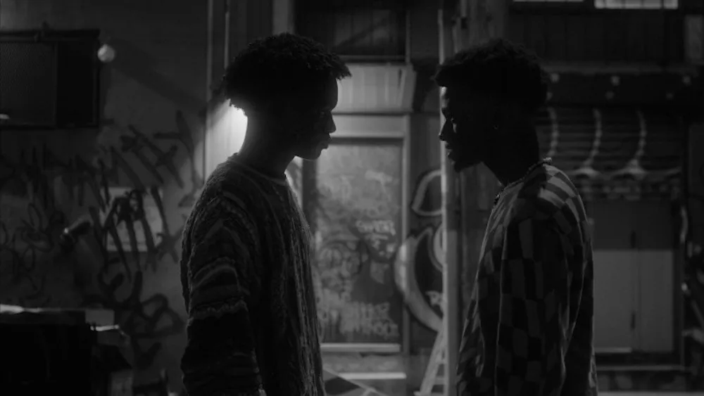 two men speak outside
