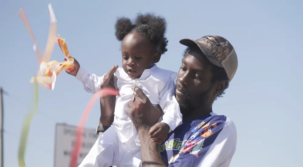 a parents holds a child in their arms