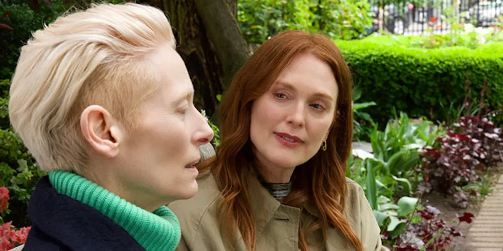 Two woman talking in a park. 