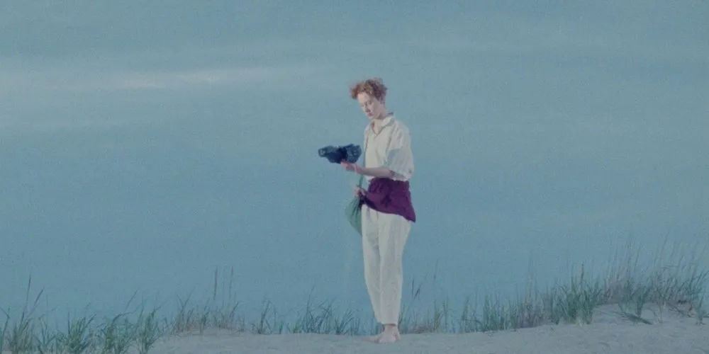 A woman stands in a beach