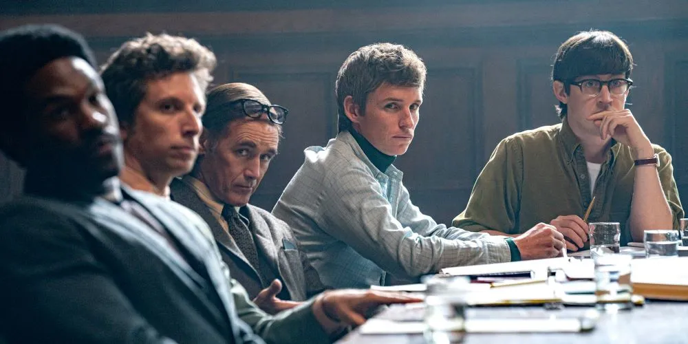 Men of different ages seated around a table
