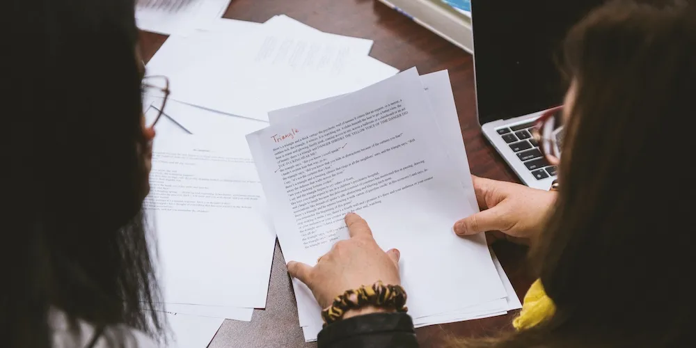 two students look over an assignment together