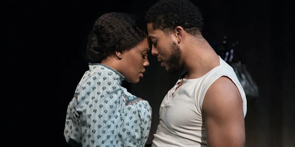 A couple holding each other on stage