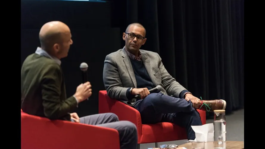 Two panelists talking.
