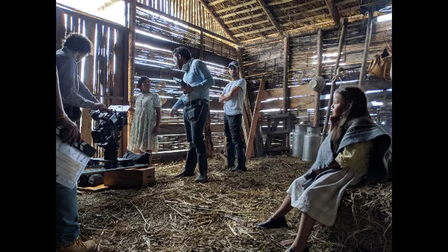 Film shoot inside barn.