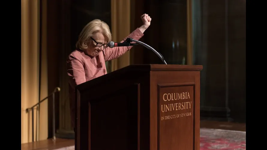 A woman at the podium.