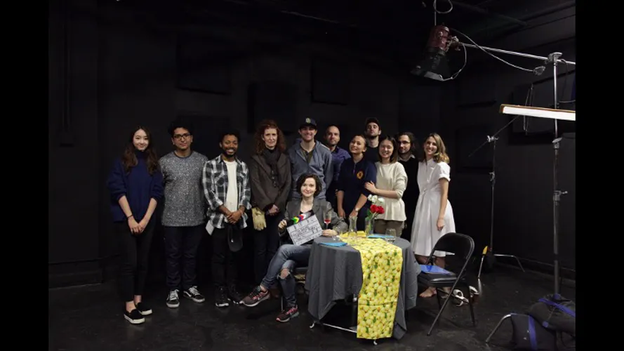 Group of film students posing for a crew photo.
