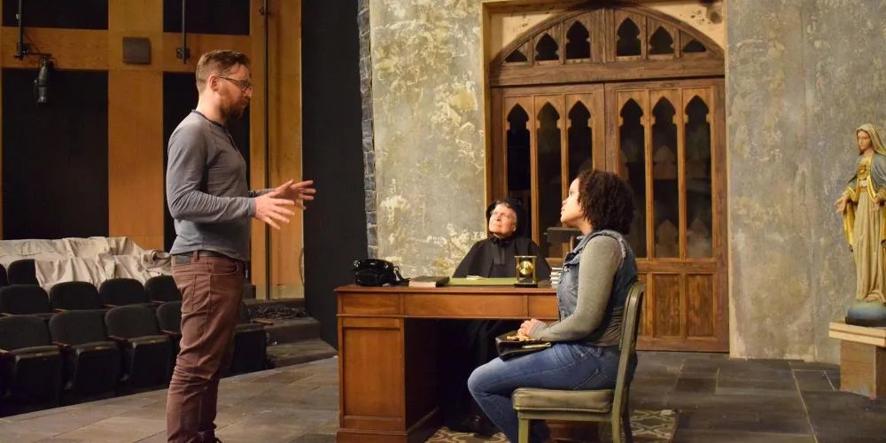 Alumnus Matt Torney '09 (left) on set with actors Sarah Marshall (center) and Tiffany M. Thompson (right)
