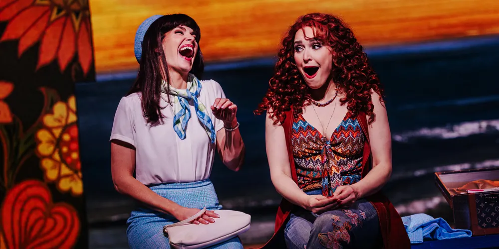 two performers on stage