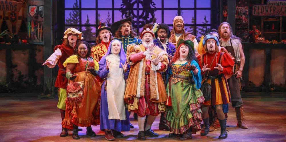 a group of actors in historical costumes on stage