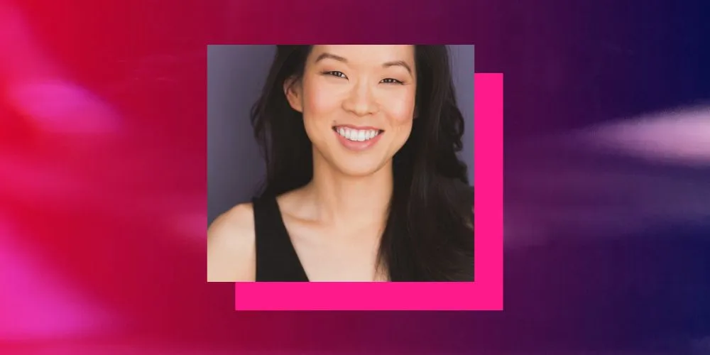 Headshot of a woman in black sleeveless shirt with pink and purple border. 