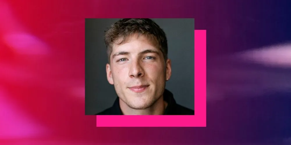 Headshot of young man with pink and purple border. 
