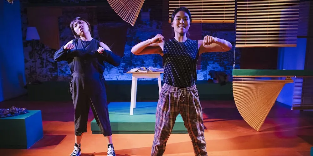 Two women on a stage