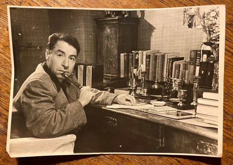 Old photograph of man seated at desk