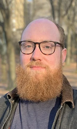 man with beard and glasses