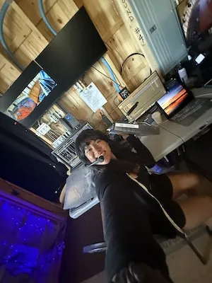 a person wearing a headset works behind the scenes