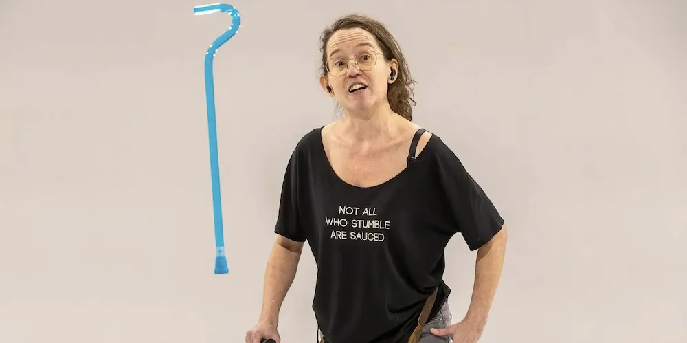 Woman in black t-shirt on stage. 