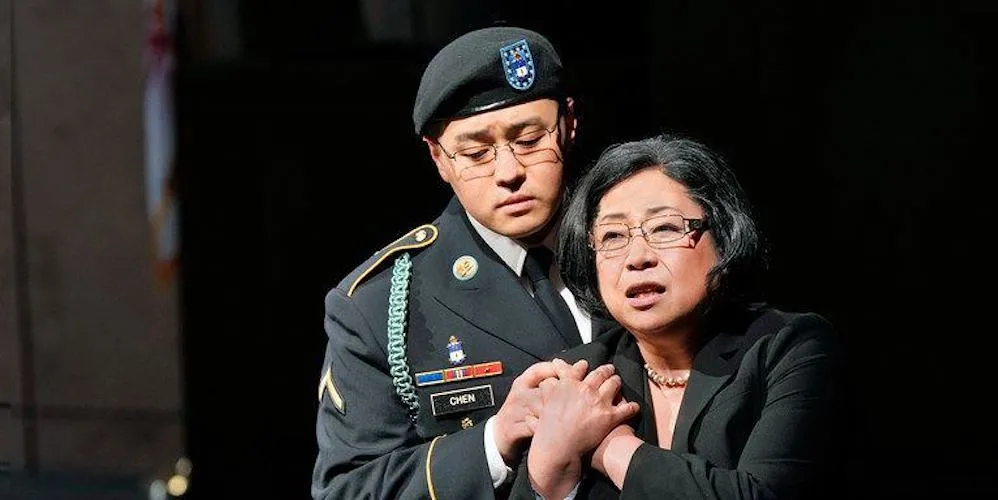 Production still from 'An American Soldier,' soldier with his hand on a woman's shoulder