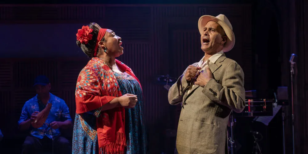 Production still from 'Buena Vista Social Club,' a man and woman singing