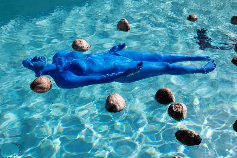 blue mannequin in water