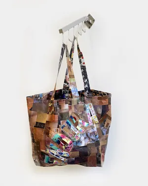 Elzie Williams III, 'Endured' (24 x 6 x 24 inches, collage of brown tone swatches with/ multicultural faces on reverse, clear tape, bandages, thread, display rack, 2022) Courtesy of M+B Gallery