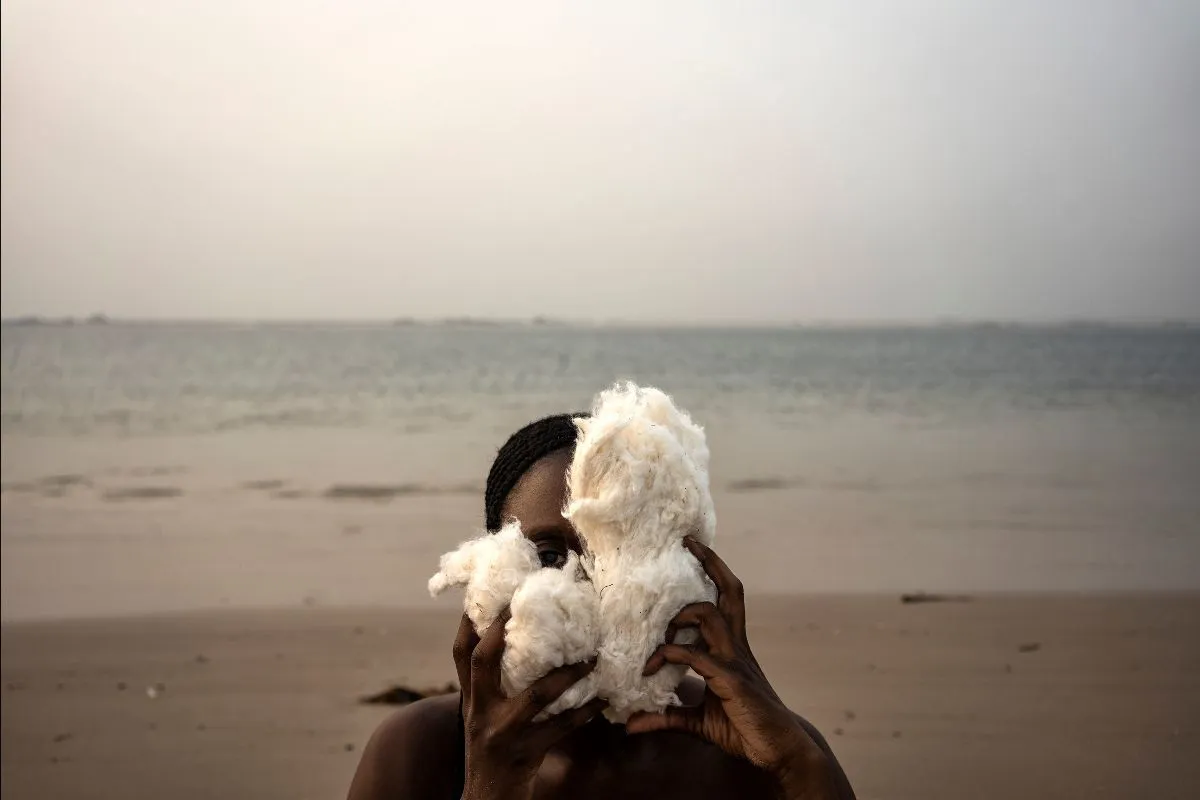 Person in front of the ocean.