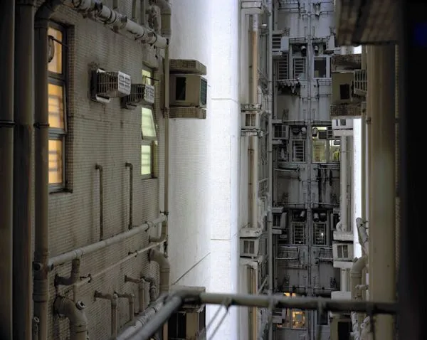 industrial alley way between tall buildings
