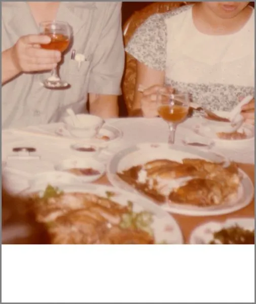 Sepia photograph of two people eating