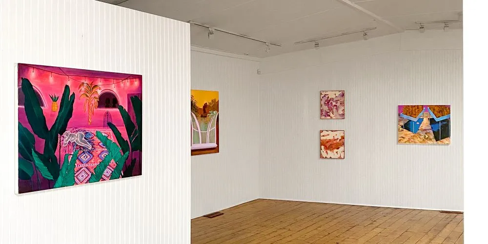 Paintings hanging in a gallery