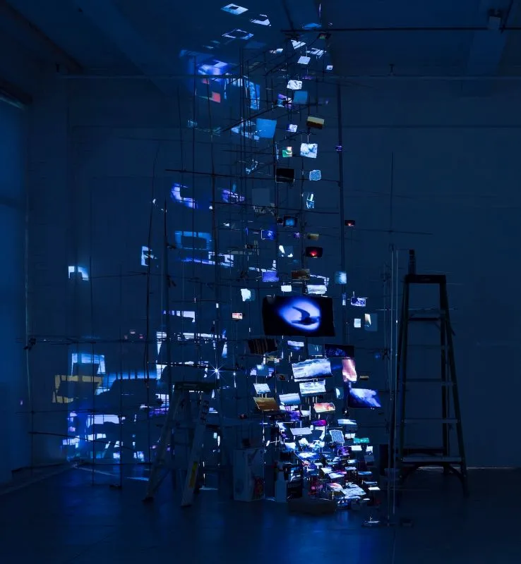 Installation of articulated prints illuminated by blue lights