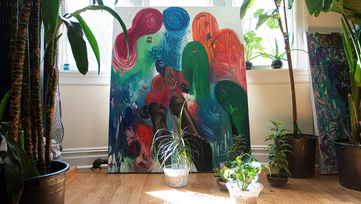 Abstract image of colorful blobs overlooking a man.