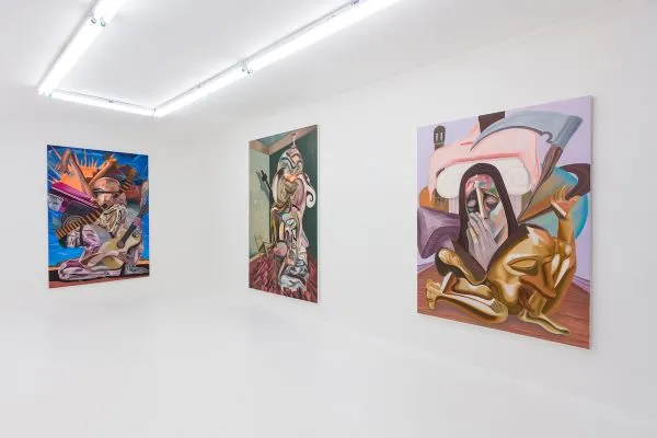 three paintings in a gallery