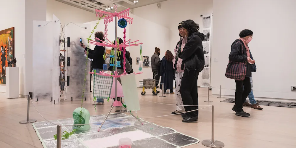students in exhibit space, sculpture