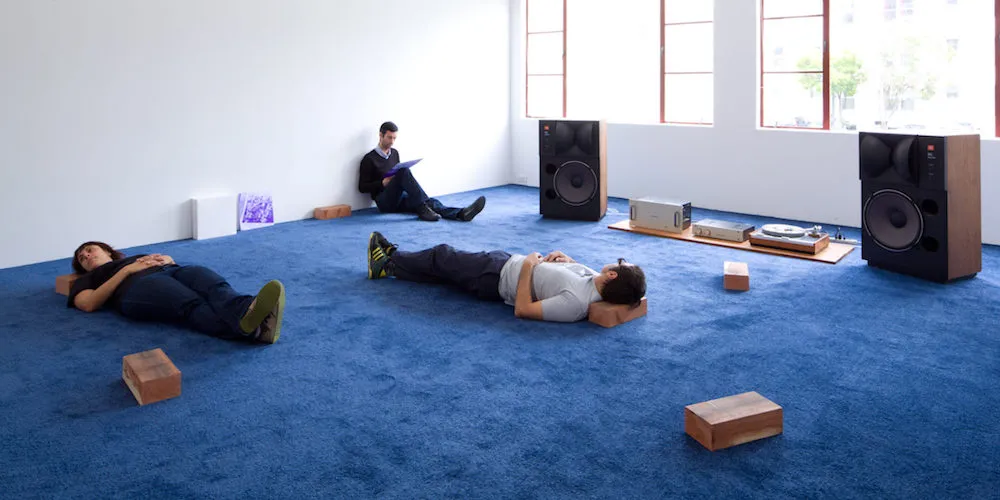 Professor Rirkrit Tiravanija and Nico Dockx 'untitled 2011' (erased Rirkrit Tiravanija demonstration drawing, stereo equipment, blue carpet, wooden Thai pillow blocks, drawings and vinyl. Dimensions variable. 2011) Installation view, Courtesy the artist and 1301PE, Los Angeles, 2011. Photo: Fredrik Nilsen