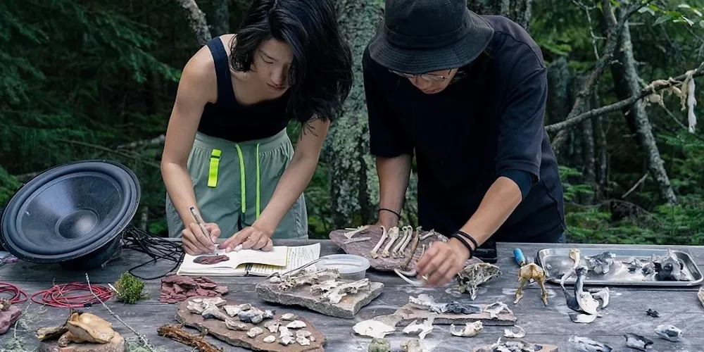 Two artists with materials