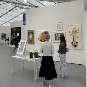prints on display in a gallery space