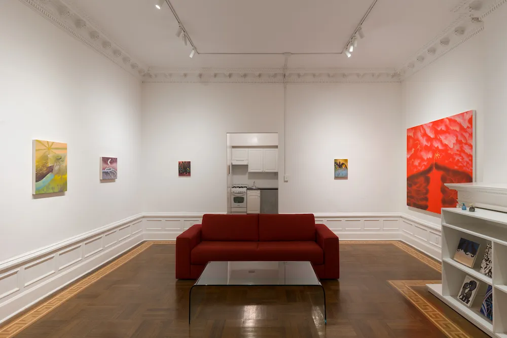 Interior of a nyc apartment with art on the walls. 