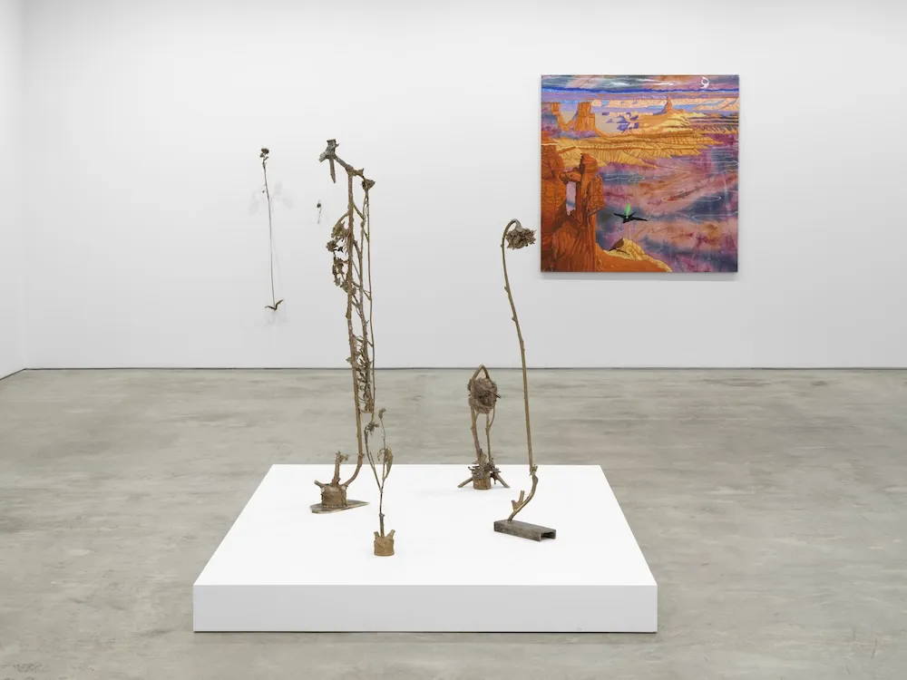 sculpture and painting on display in an art gallery