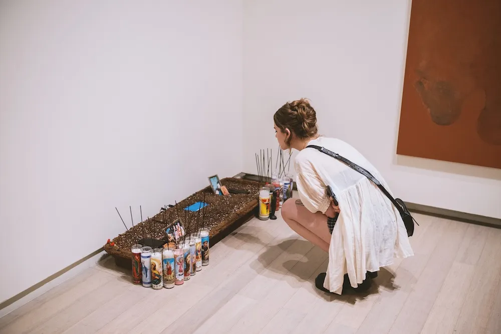 Person looking an at art installation.