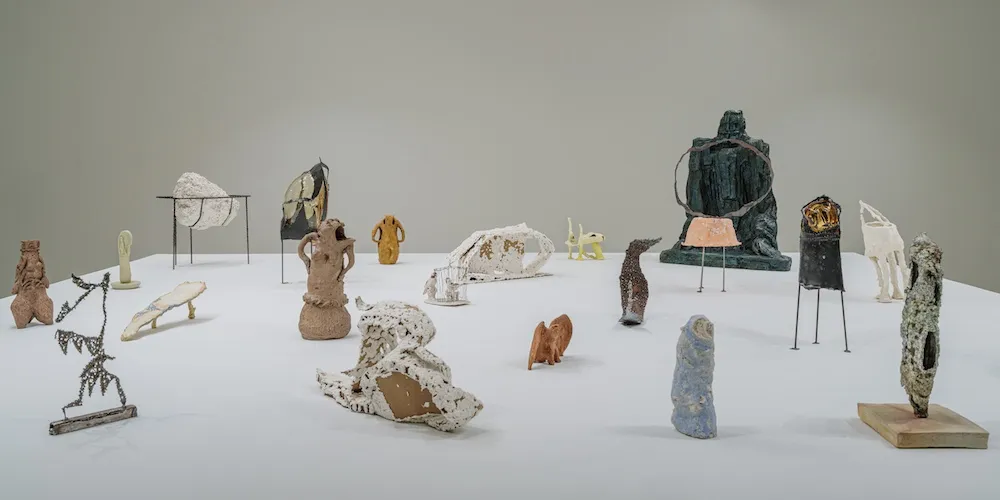 Sculptures displayed on a large surface. 