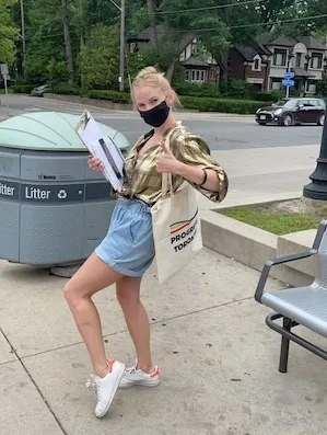Emily Johnson with Progress Toronto street canvas for Inclusionary Zoning, July 2021