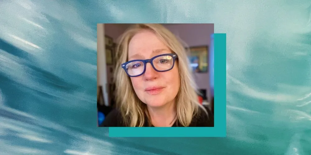 Headshot of Kathy Fagan on a blue background