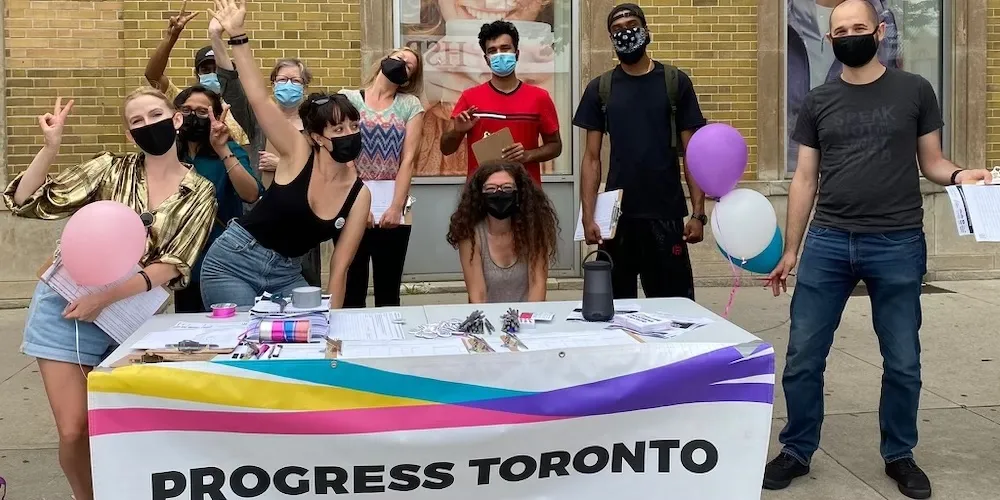 Emily Johnson with Progress Toronto street canvas for Inclusionary Zoning, July 2021