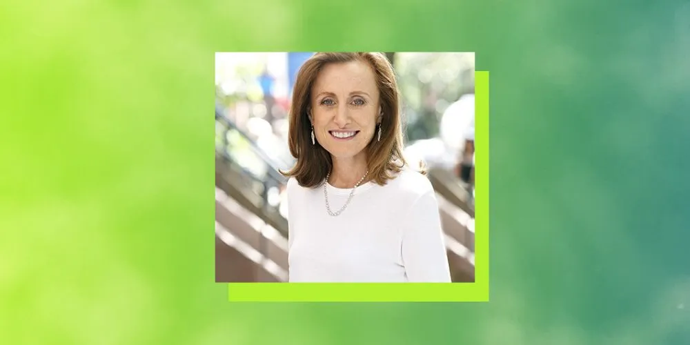 Headshot of alumna Mona Simpson on a green background