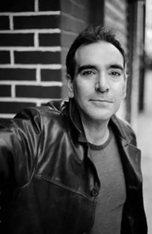Headshot of Aaron Poochigian